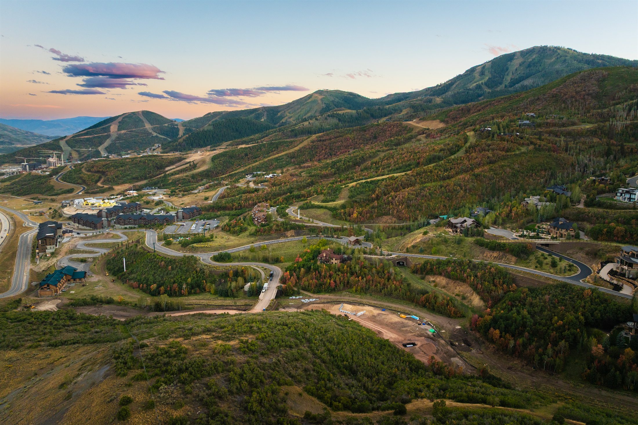 Aerial view of The Havens site at dusk with Deer Valley's ski runs and fall color beyond